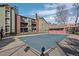 Community pool with adjacent residential buildings at 4899 S Dudley St # 3A, Littleton, CO 80123