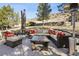 Outdoor seating area with comfortable sofas, chairs, a heater, and a coffee table at 6960 Choke Cherry Way, Littleton, CO 80125