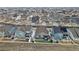 Aerial view of home showcasing the property's location among neighborhood streets, backyards and rooftops at 6956 S Titus St, Aurora, CO 80016