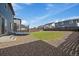 The backyard has a trampoline and well-maintained lawn, great for recreation at 26789 E Cedar Ave, Aurora, CO 80018