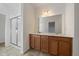 Primary bathroom with double sink vanity, large mirror and glass-enclosed shower at 26789 E Cedar Ave, Aurora, CO 80018