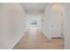Hallway showcases new flooring and a bright interior with access to the rest of the home at 26789 E Cedar Ave, Aurora, CO 80018