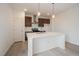 Bright kitchen features a large island, modern appliances, stylish cabinets, and contemporary pendant lighting at 26789 E Cedar Ave, Aurora, CO 80018