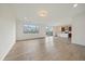 Open-concept living room features large windows offering an abundance of natural light throughout the home at 26789 E Cedar Ave, Aurora, CO 80018