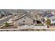 An aerial view of a lovely home boasting a cozy backyard patio within a well-maintained and inviting residential community at 19543 E 54Th Ave, Denver, CO 80249