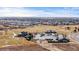 Aerial view of the clubhouse and surrounding community with ample parking and amenities at 19543 E 54Th Ave, Denver, CO 80249