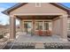 Covered back patio with seating and space for outdoor entertaining at 19543 E 54Th Ave, Denver, CO 80249