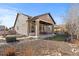 A back patio with a covered porch offering an inviting area for relaxation and enjoying the outdoor scenery at 19543 E 54Th Ave, Denver, CO 80249