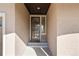 Inviting front entrance features a decorative storm door with glass panels and a covered porch at 19543 E 54Th Ave, Denver, CO 80249