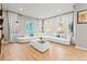 Open-concept living room filled with natural light and hardwood flooring at 17720 W 94Th Dr, Arvada, CO 80007