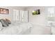 Serene main bedroom with sitting area, exterior door, and an en suite bathroom at 17720 W 94Th Dr, Arvada, CO 80007