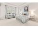 Spacious main bedroom featuring bright natural light and a sitting area at 17720 W 94Th Dr, Arvada, CO 80007
