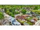 An aerial view of a charming property with well-manicured lawn and mature trees at 3928 Zuni St, Denver, CO 80211