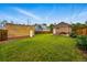 A lush backyard with a detached garage, outdoor seating, and well-manicured lawn at 3928 Zuni St, Denver, CO 80211