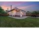 A large backyard with a well-maintained lawn and outdoor seating area at 3928 Zuni St, Denver, CO 80211