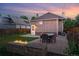 A beautiful backyard with a fire pit, dining space, and fenced yard at 3928 Zuni St, Denver, CO 80211