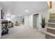 Finished basement with carpet flooring, a bar cart, comfortable seating and neutral decor at 3928 Zuni St, Denver, CO 80211