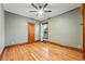 Bedroom with hardwood floors, a ceiling fan, trim work, and a window with natural light at 3928 Zuni St, Denver, CO 80211