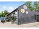 A street view of retail space exterior with gray paint and vintage signs at 3928 Zuni St, Denver, CO 80211