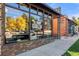A exterior view of retail space, featuring brick and inviting windows at 3928 Zuni St, Denver, CO 80211