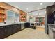 Spacious kitchen has stainless appliances and a view into the dining room and offers ample cooking and counter space at 3928 Zuni St, Denver, CO 80211