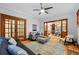 Spacious living room with wooden floors, open to dining area, with bright and neutral tones at 3928 Zuni St, Denver, CO 80211