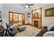 Cozy living room with exposed brick fireplace and wood trim, creating a warm and inviting space at 3928 Zuni St, Denver, CO 80211