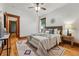Comfortable bedroom with ceiling fan, window and view to an additional room at 3928 Zuni St, Denver, CO 80211