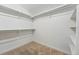 An empty walk-in closet offers plenty of space for storage at 3928 Zuni St, Denver, CO 80211