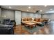 Finished basement with a large sectional couch, wood floors, and a pool table at 9325 Lark Sparrow Dr, Highlands Ranch, CO 80126