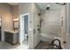 Modern bathroom featuring a glass shower, sleek fixtures, and stone accents at 9325 Lark Sparrow Dr, Highlands Ranch, CO 80126