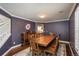 Formal dining room features hardwood floors, wainscoting, and a large wooden table at 9325 Lark Sparrow Dr, Highlands Ranch, CO 80126