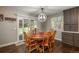 Cozy dining room with wood table, chairs, and a sliding door leading to the backyard at 9325 Lark Sparrow Dr, Highlands Ranch, CO 80126