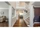 Spacious foyer with hardwood floors, a staircase, and an open view into the living spaces at 9325 Lark Sparrow Dr, Highlands Ranch, CO 80126