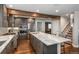 Spacious kitchen featuring a large island, stainless appliances, and hardwood floors at 9325 Lark Sparrow Dr, Highlands Ranch, CO 80126