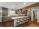 Stylish kitchen boasts a large island with seating, stainless steel appliances, and elegant gray cabinetry at 9325 Lark Sparrow Dr, Highlands Ranch, CO 80126