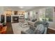 Inviting living room with a fireplace, comfortable seating, and natural light at 9325 Lark Sparrow Dr, Highlands Ranch, CO 80126