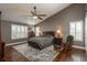 Spacious main bedroom with vaulted ceiling, hardwood floors, and large windows at 9325 Lark Sparrow Dr, Highlands Ranch, CO 80126