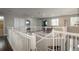 The bright upper hallway features lots of natural light, an open railing, and access to the bedrooms at 9325 Lark Sparrow Dr, Highlands Ranch, CO 80126