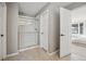 Modern bathroom with tiled floors, shower, and an open doorway to the bedroom at 1711 Spring Water Ln, Highlands Ranch, CO 80129