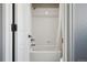 Bright bathroom with shower and tub combination, white tile, and chrome fixtures at 1711 Spring Water Ln, Highlands Ranch, CO 80129