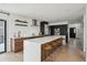 Modern kitchen with white countertops, wood cabinets, and stainless steel appliances at 1711 Spring Water Ln, Highlands Ranch, CO 80129