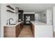 Sleek kitchen featuring wooden cabinets, modern stainless steel appliances, and long island at 1711 Spring Water Ln, Highlands Ranch, CO 80129