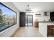 Kitchen with sliding glass door, stainless steel sink, and modern cabinets at 1711 Spring Water Ln, Highlands Ranch, CO 80129