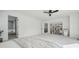 Bright, spacious main bedroom featuring a ceiling fan and an open ensuite at 1711 Spring Water Ln, Highlands Ranch, CO 80129