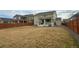 Large backyard with grassy area and wooden fence at 2521 E 163Rd Pl, Thornton, CO 80602