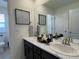 Double vanity bathroom with marble countertop at 2521 E 163Rd Pl, Thornton, CO 80602
