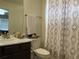 Clean bathroom with a shower/tub combo and dark vanity at 2521 E 163Rd Pl, Thornton, CO 80602