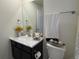 Stylish bathroom with marble countertop and dark cabinets at 2521 E 163Rd Pl, Thornton, CO 80602