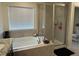 Bathroom with soaking tub and walk-in shower at 2521 E 163Rd Pl, Thornton, CO 80602